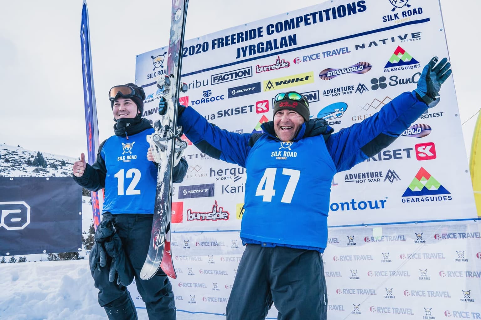 Riders celebrating at a Silk Road Freeride competition podium
